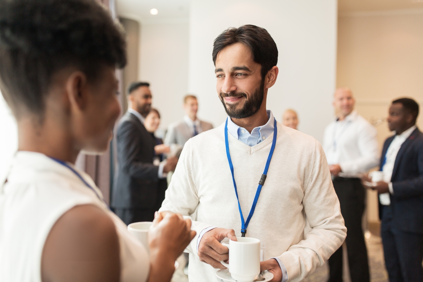 Professionals networking at an industry event